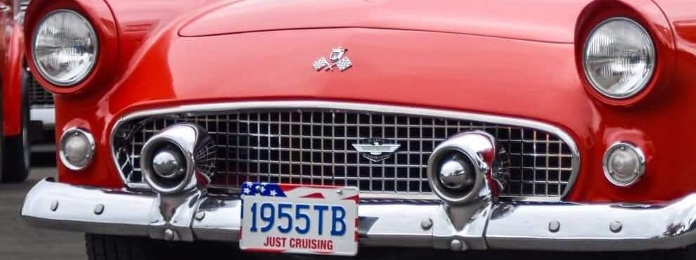 Chrome grille and bumper guards of the 1955 Thunderbird with its 1955TB plate