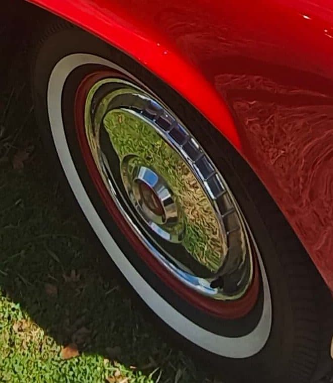 Whitewall tyre and chrome hubcap on the Torch Red Thunderbird